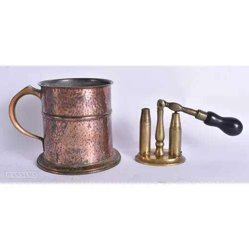 AN ART DECO HAMMERED COPPER AND BRONZE TANKARD together with...