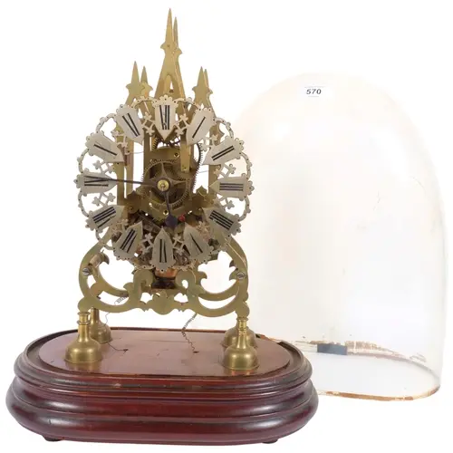 A brass skeleton clock on wooden plinth, under glass dome A/...