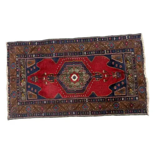 Vintage hand woven blue, brown and red ground wool rug. 203c...