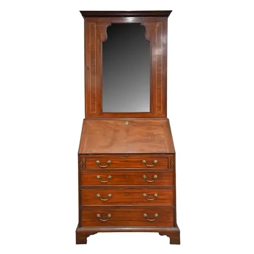 A George III mahogany bureau bookcase, the associated mahoga...