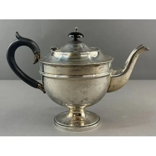 Silver: a pedestal teapot by Emile Viner, Sheffield 1934, wi...
