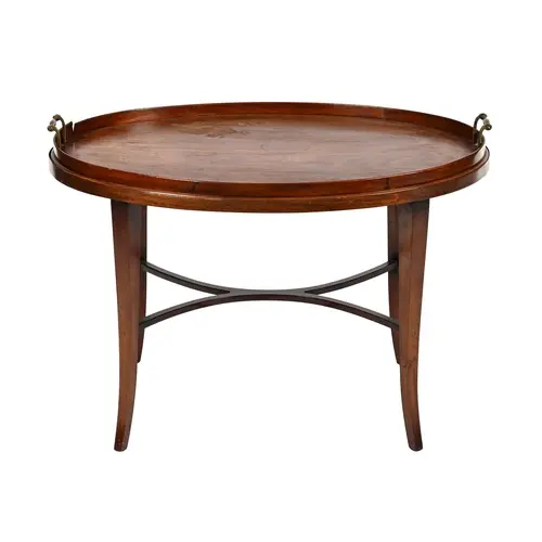 A George III oval mahogany galleried tea tray, with brass ha...