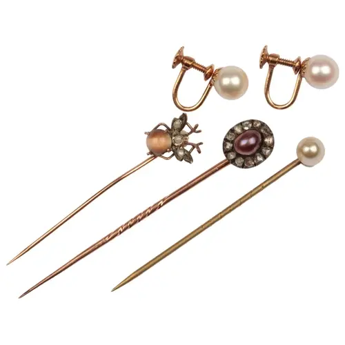 A collection of jewels including a pearl and diamond stickpi...