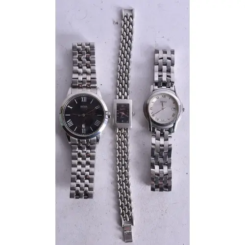 TWO GUCCI WRISTWATCHES and a Boss watch. Untested. 4.5 cm wi...