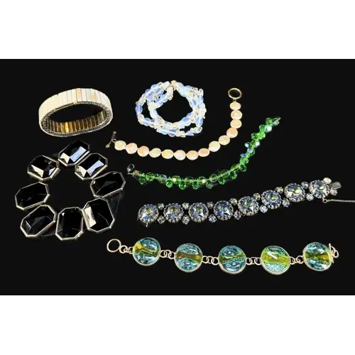 A selection of decorative vintage bracelets, glass beads, gl...