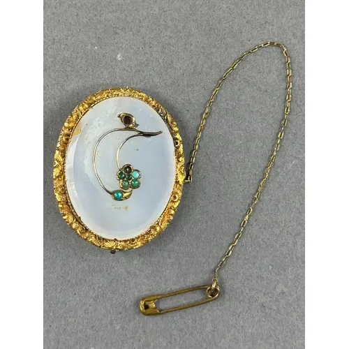 Jewellery: a yellow metal and chalcedony floral brooch, the ...