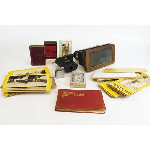 A Victorian hand held walnut stereoscopic viewer by The Lond...