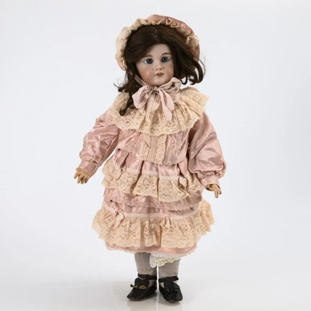 French doll in a pink dress. Jumeau.
