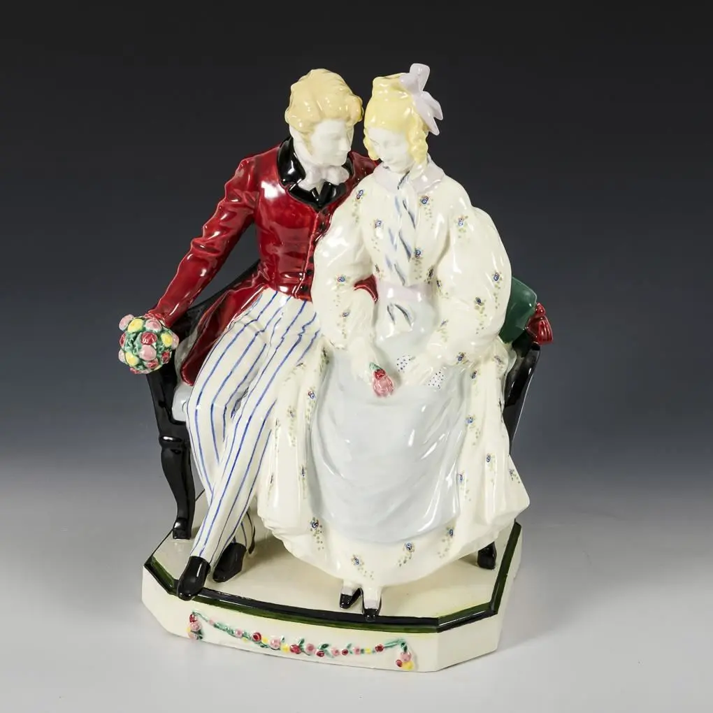 Couple sitting on a sofa. Keramos, Viennese art ceramics.