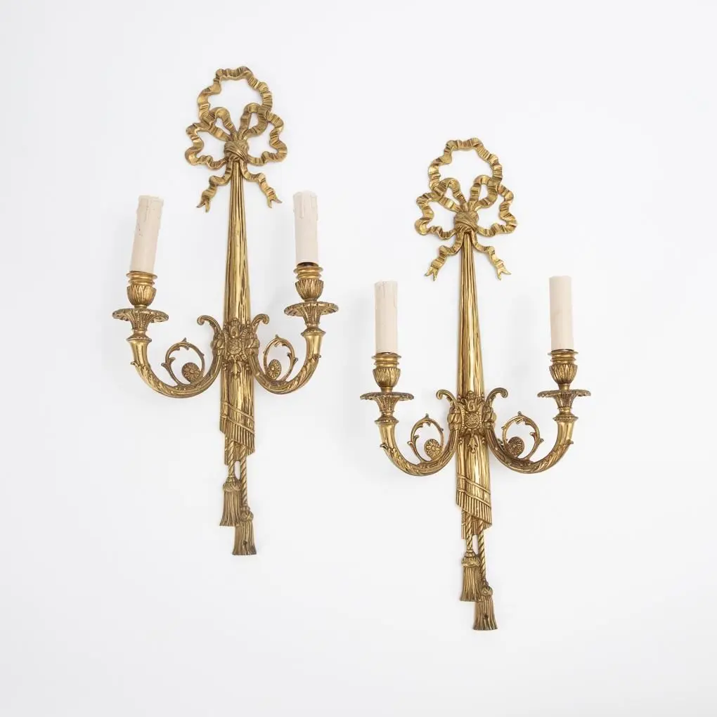 Pair of 2-flame wall sconces in the Louis XVI style.