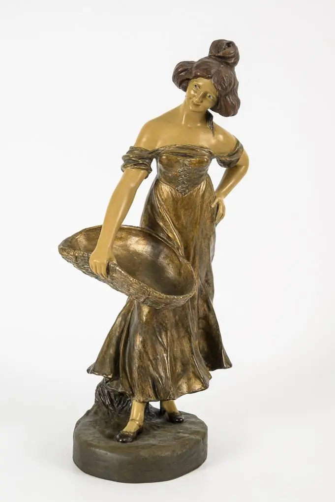 Art Nouveau figurine: Woman with a basket.