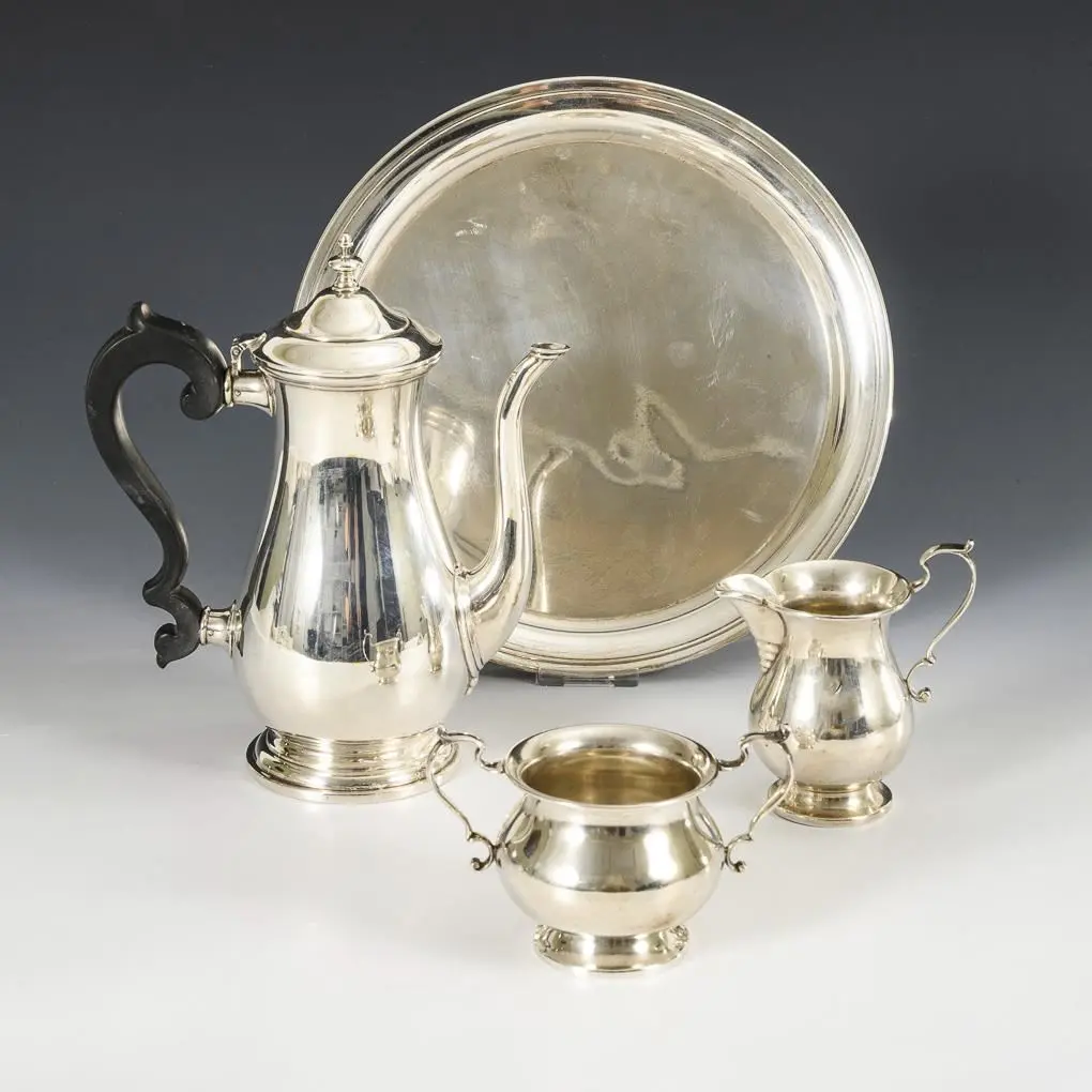 Coffee pot, milk jug, sugar bowl, and round tray.