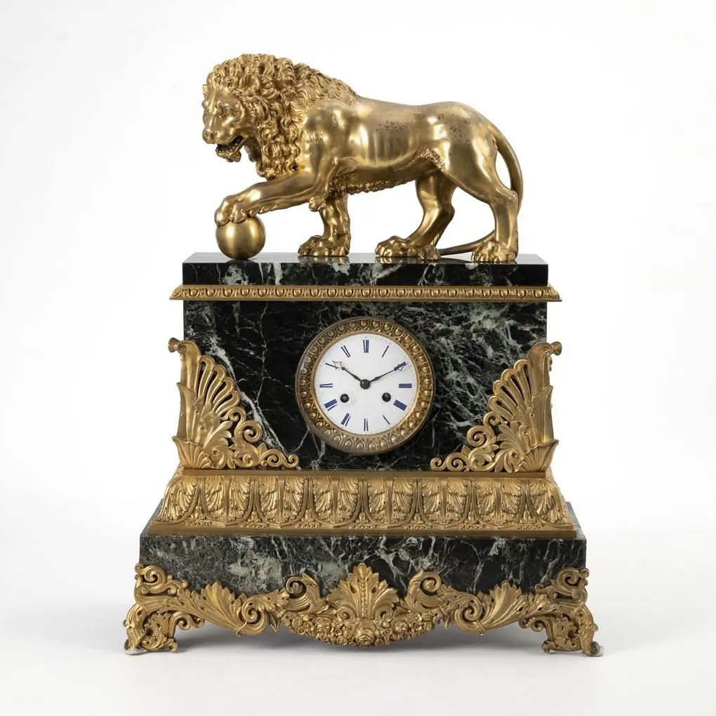 Heavy neoclassical marble pendulum clock with a lion-topped finial.