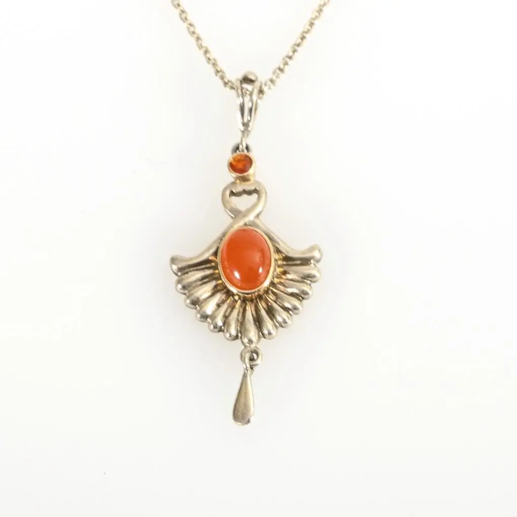 Pendant with fire opals on a chain.