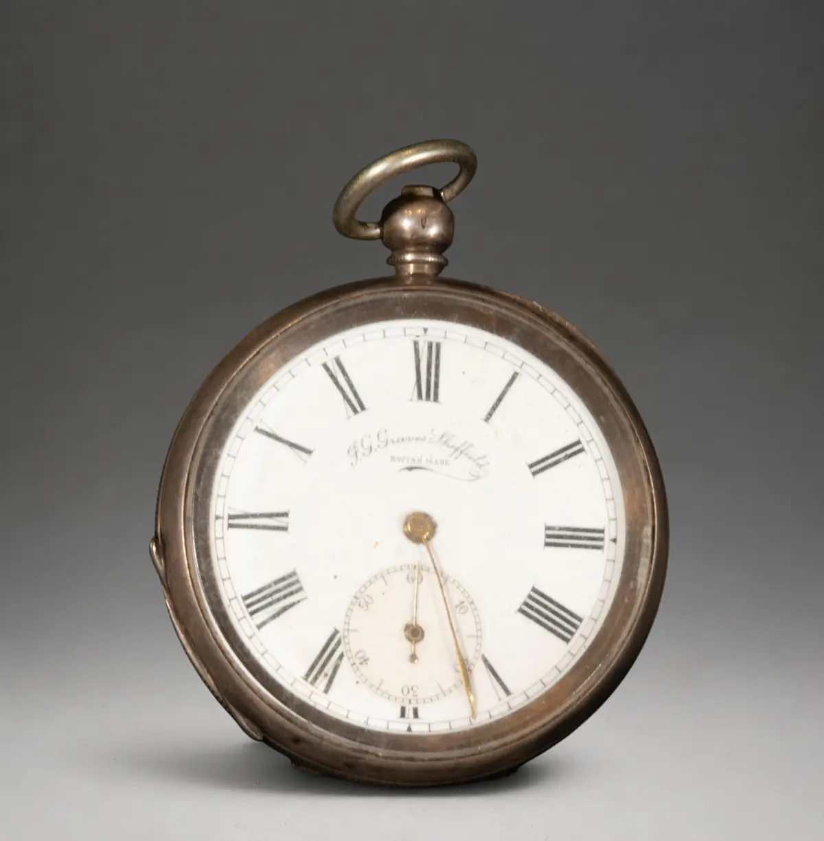 Pocket watch with engraved cover and white dial