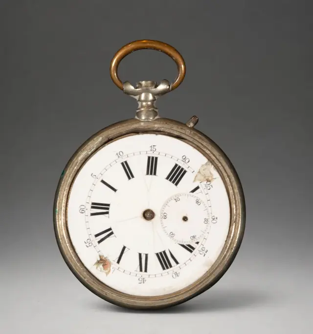 Gold pocket watch with white dial