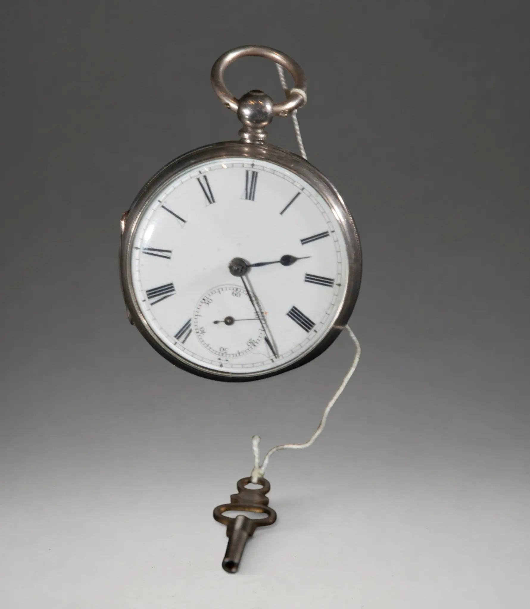 Pocket watch with winding key