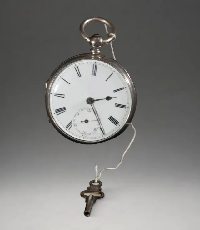 Pocket watch with winding key