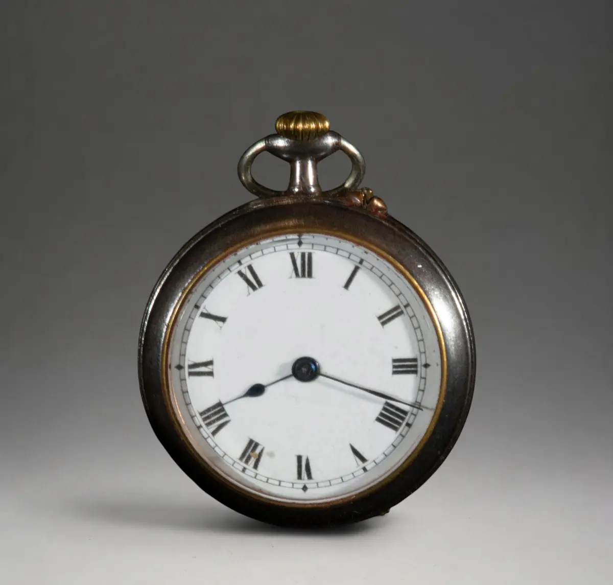 Small pocket watch with dark case