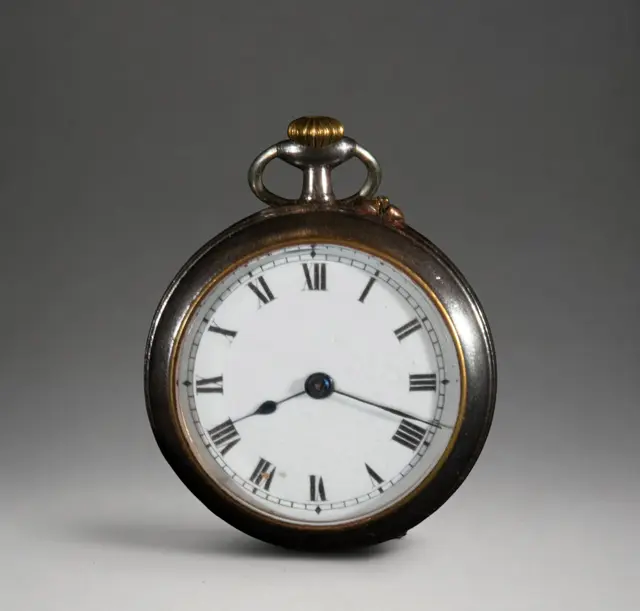 Small pocket watch with dark case
