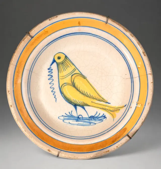 MANISES CERAMICS - Plate with yellow bird and polychrome decoration