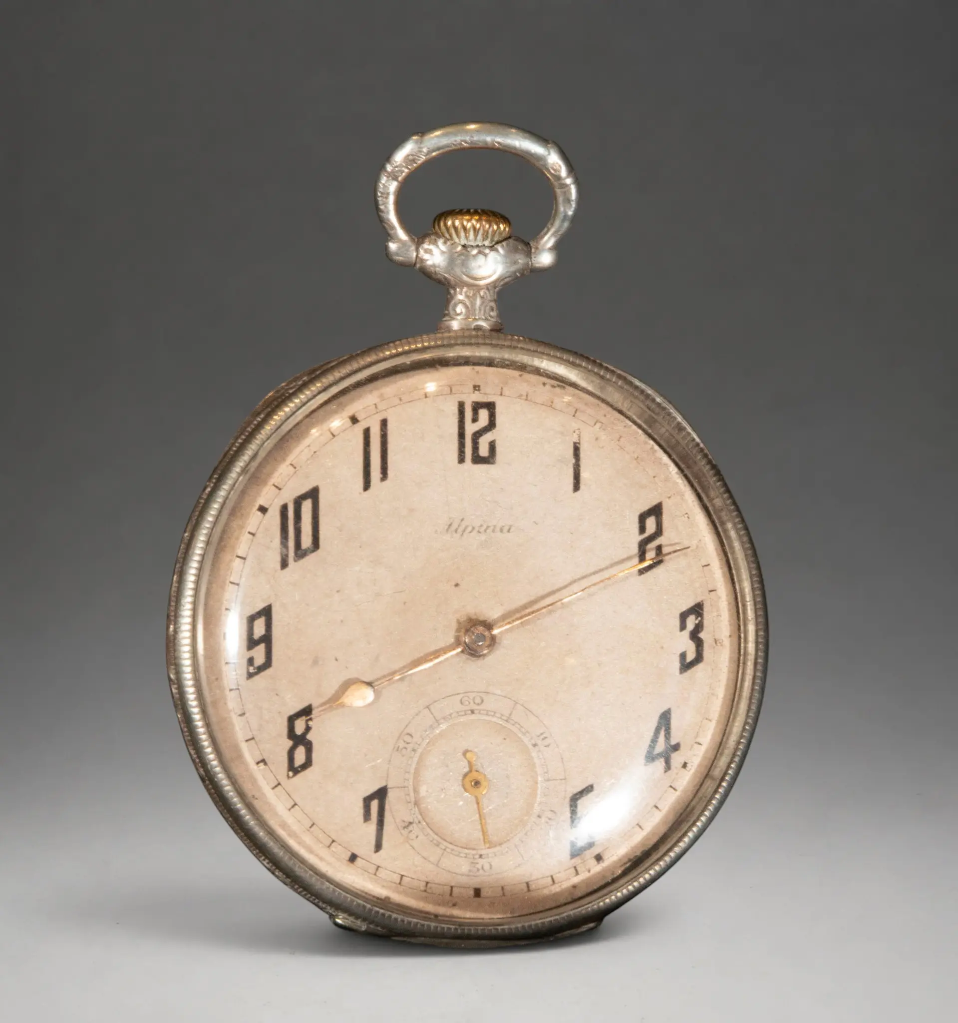 Pocket watch with stylized Arabic numerals