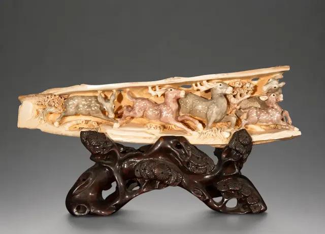 Mammoth tusk carved with deer, 20th century Chinese oriental school