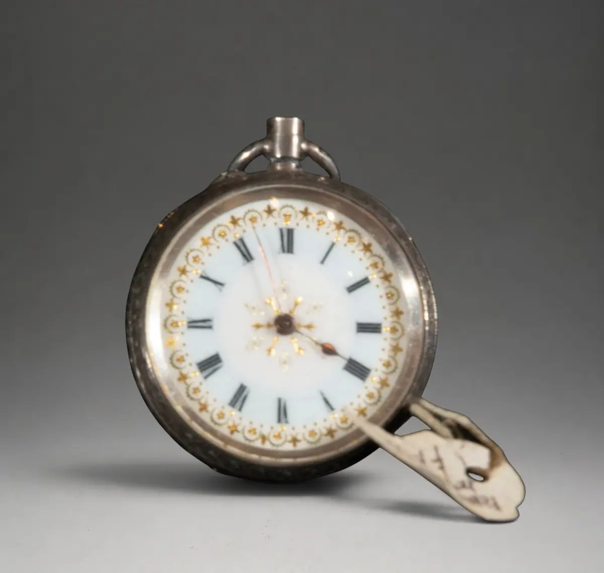Small pocket watch with white dial