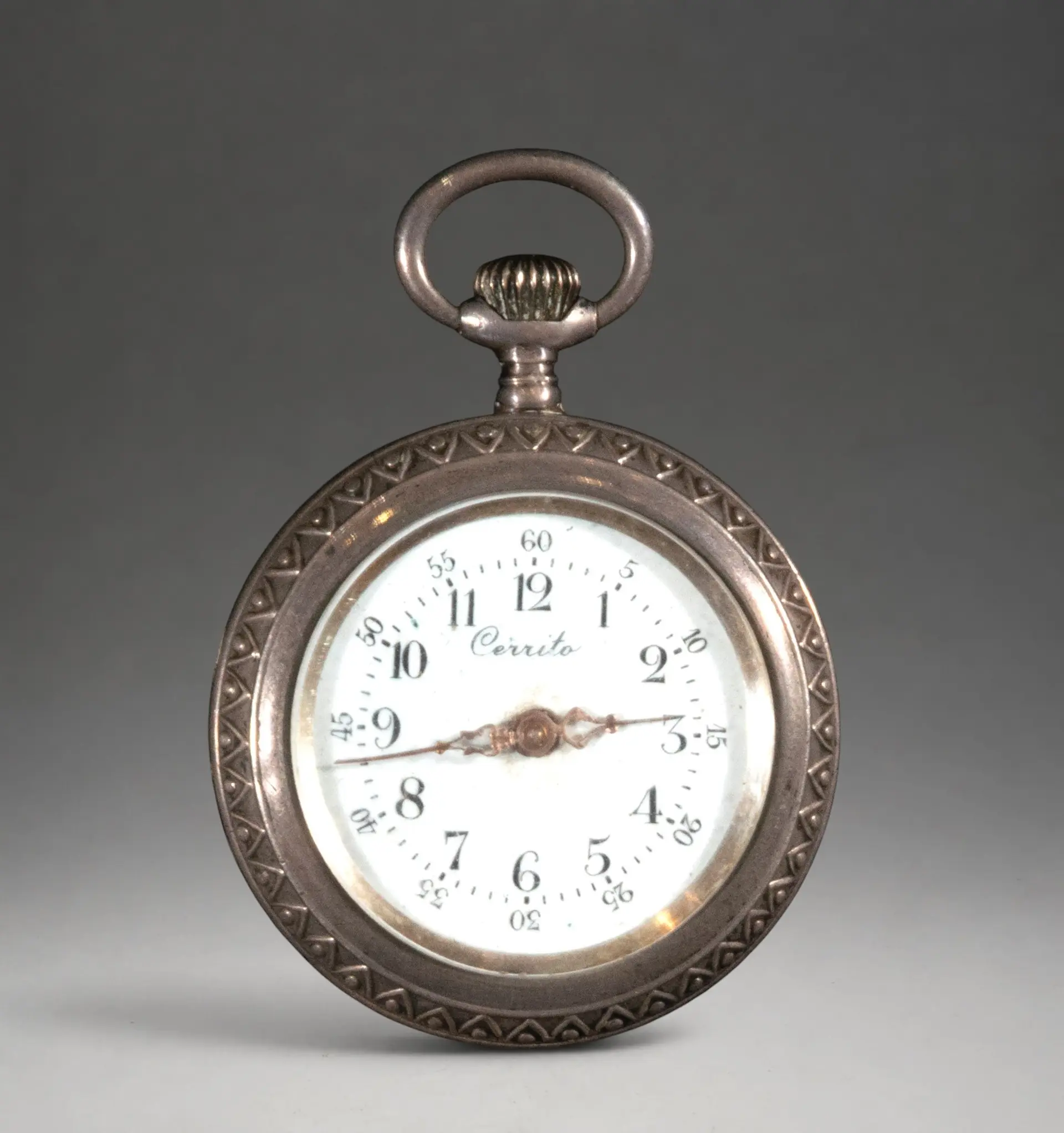 Miniature pocket watch with engraved case