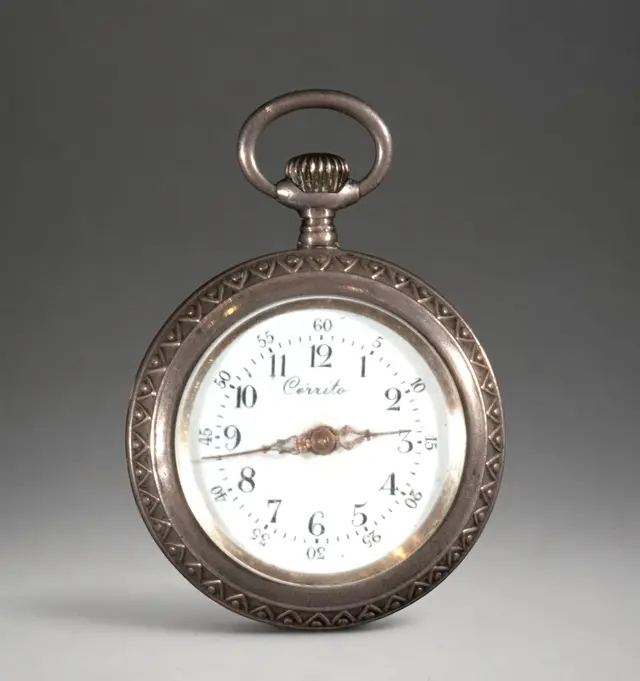 Miniature pocket watch with engraved case