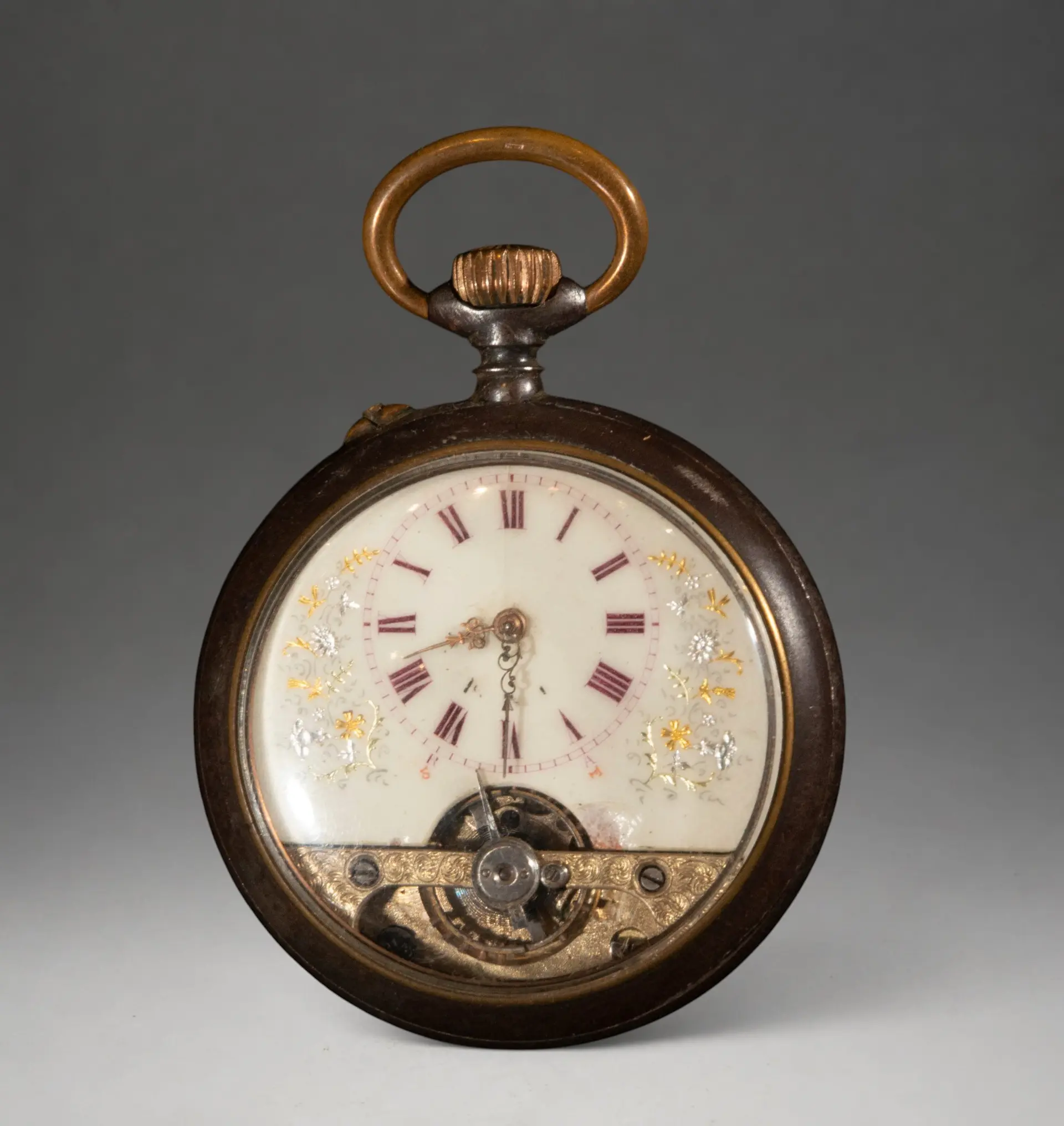 Pocket watch with visible mechanism on the dial