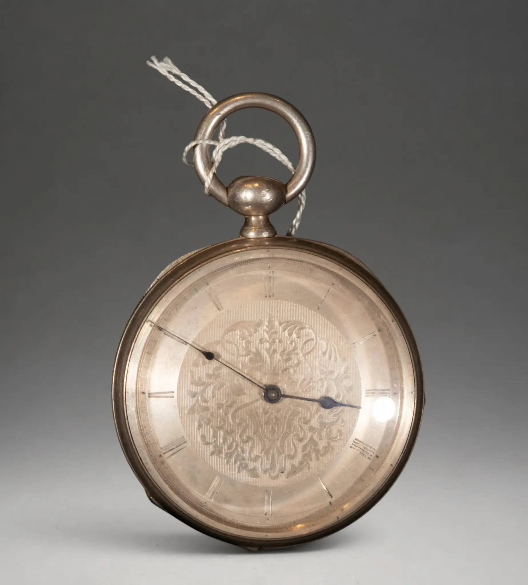 Pocket watch with decorated dial and Roman numerals