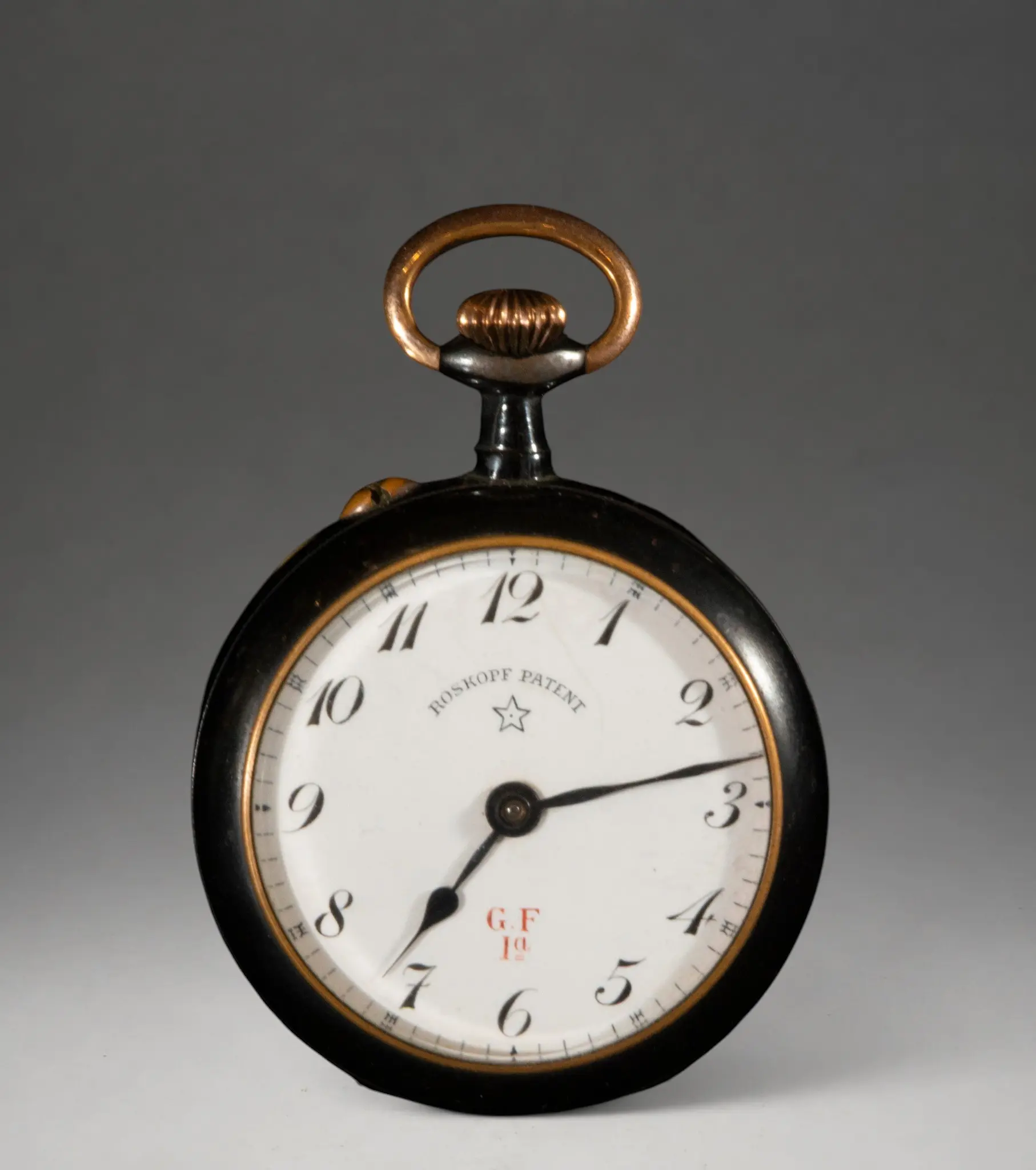 Pocket watch with white dial and dark case