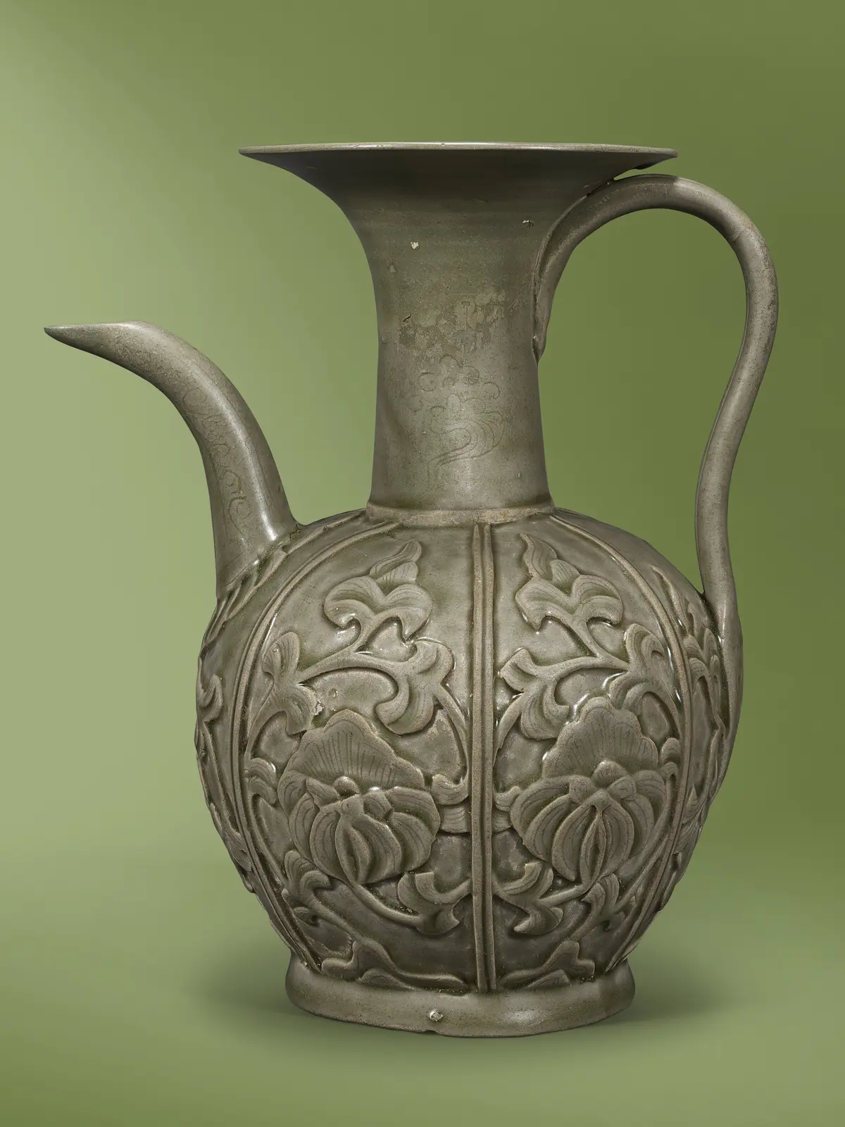 A Rare Yue Celadon Carved and Moulded 'Peony' Ewer