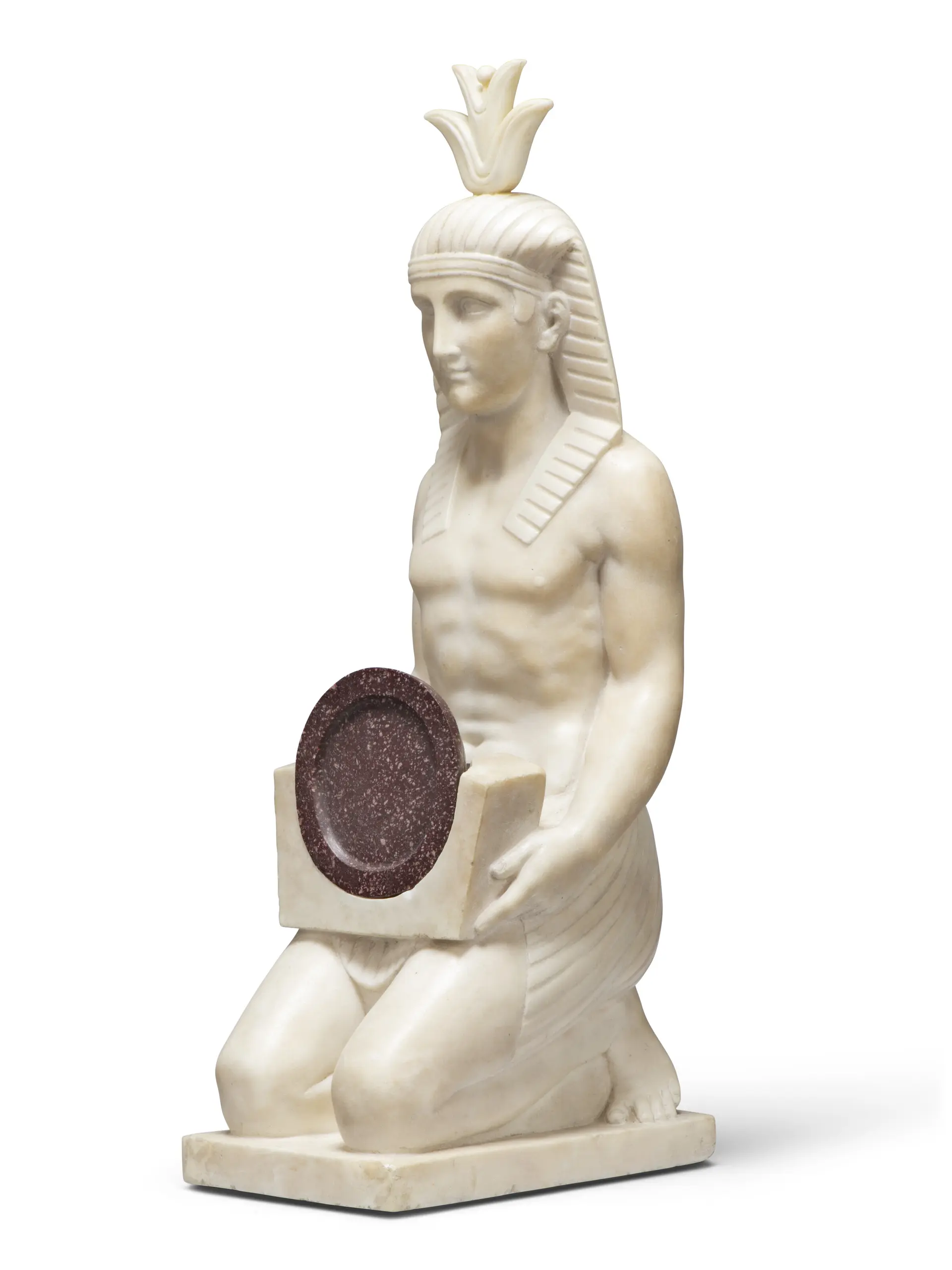A Marble and Porphyry Figure of a Kneeling Egyptian Man