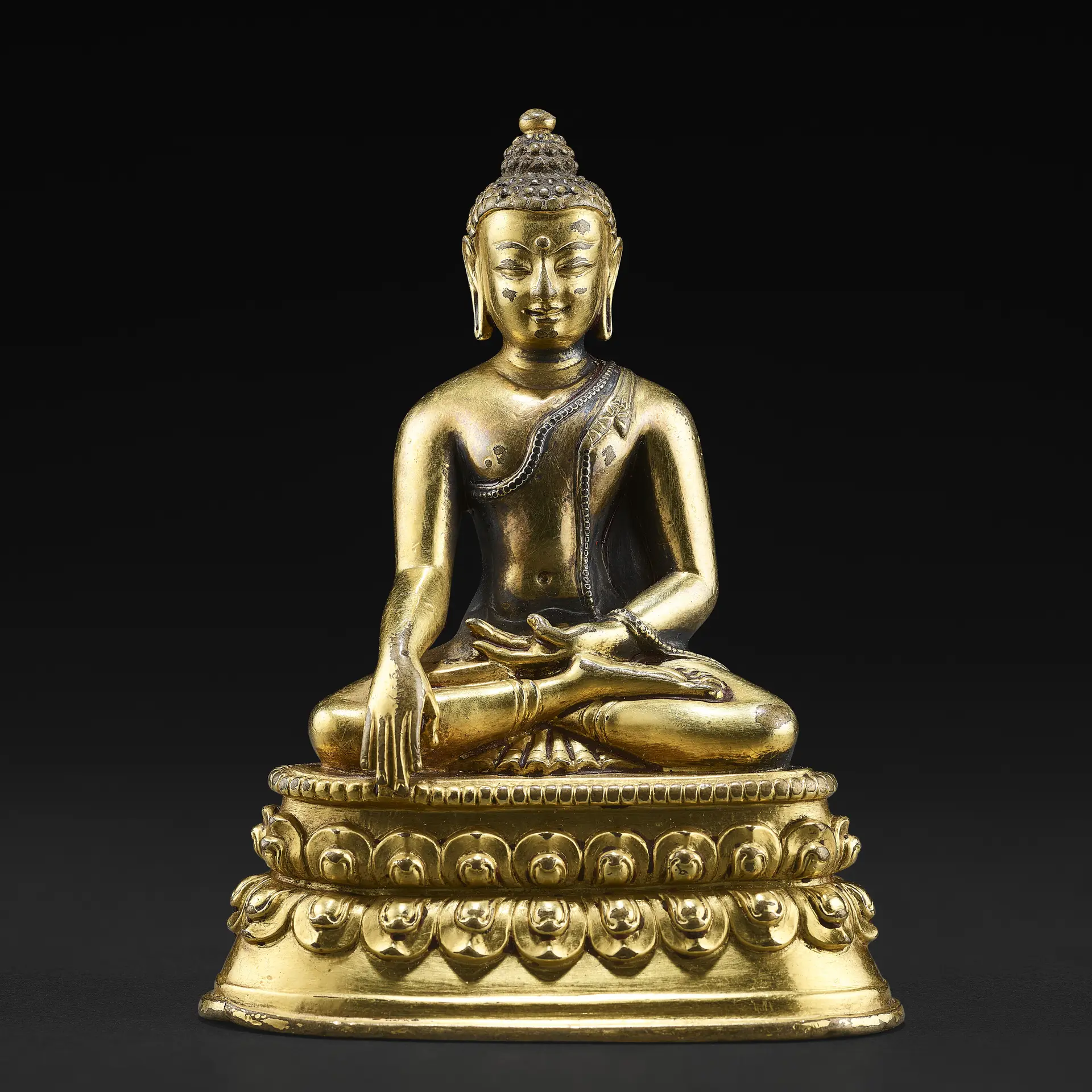 A Silver Inlaid Gilt Copper Alloy Figure of Shakyamuni Buddha