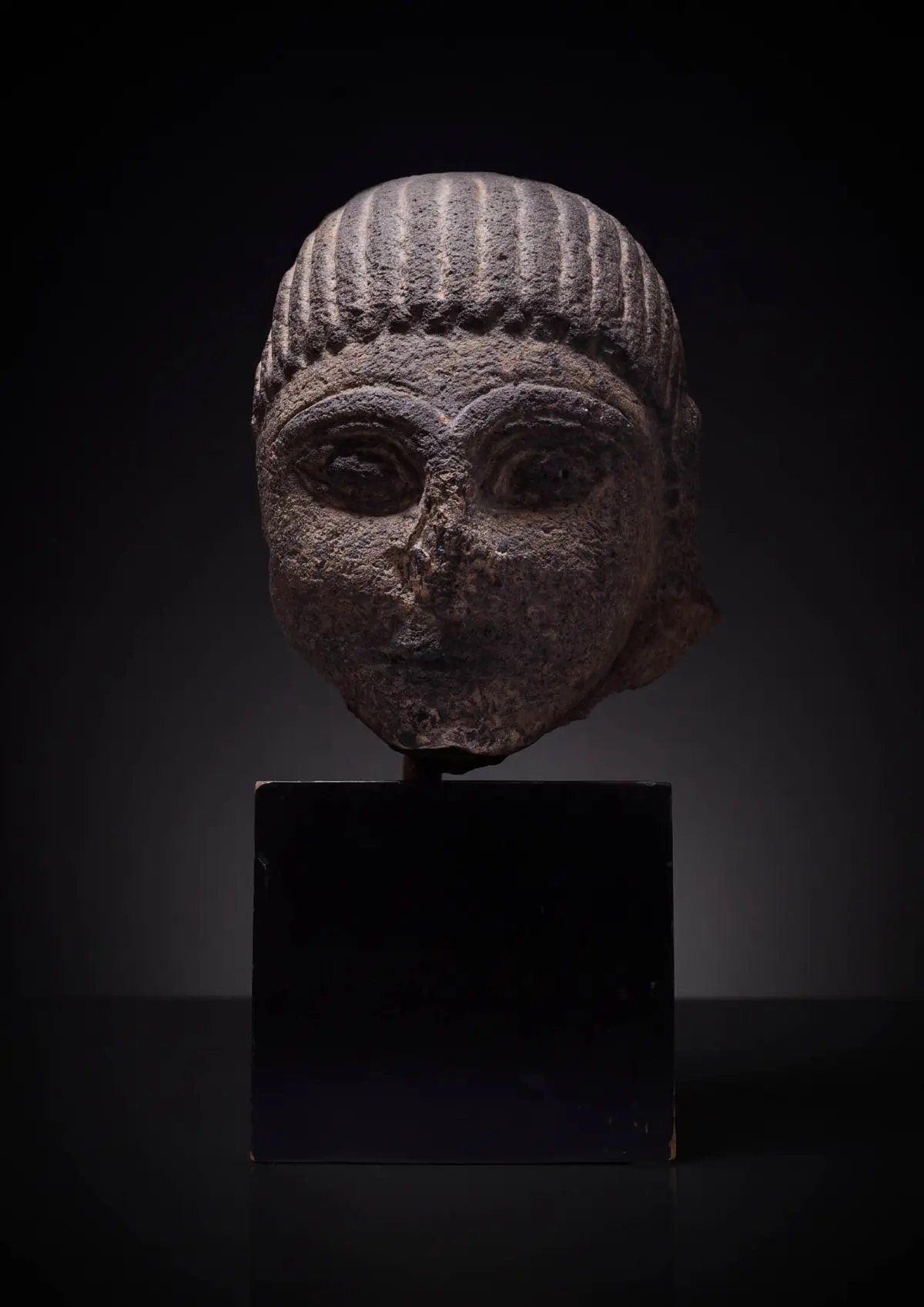 RARE ETRUSCAN NENFRO HEAD OF SPHINX