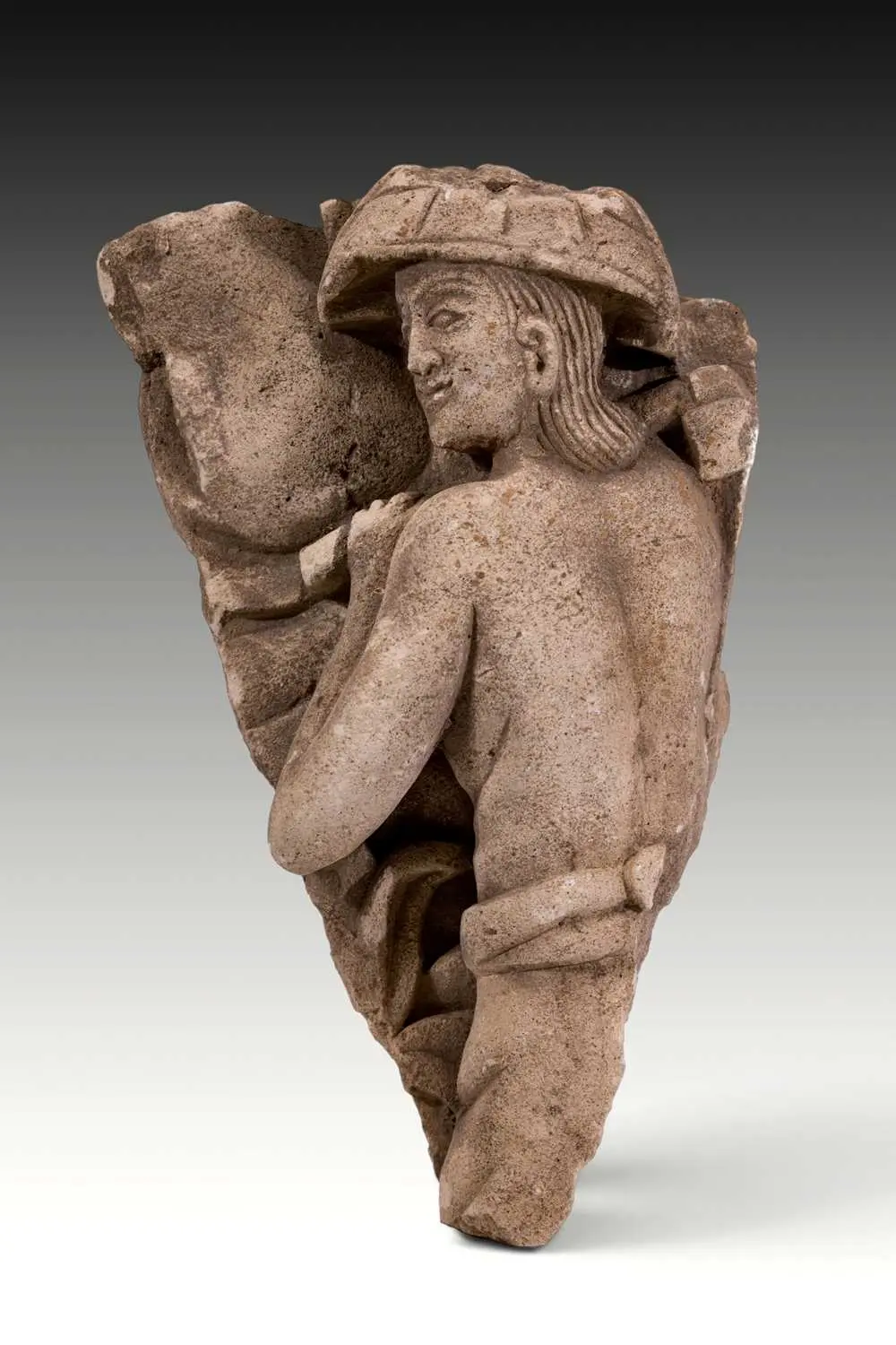 MEDIEVAL STONE HIGH RELIEF DEPICTING WORKER WITH HAMMER