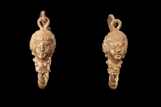 MATCHED PAIR OF HELLENISTIC GOLD EARRINGS WITH LION HEADS