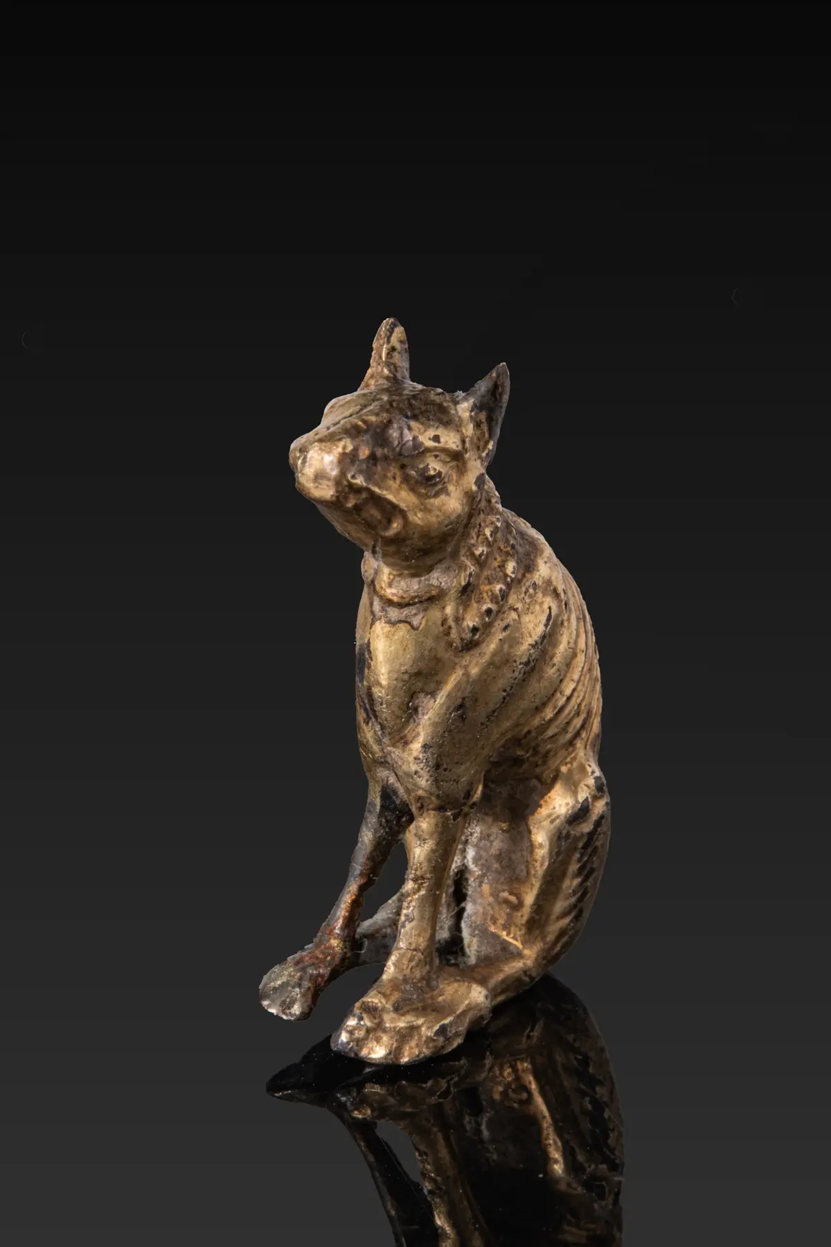 ROMAN SILVER-GILT DOG FIGURINE