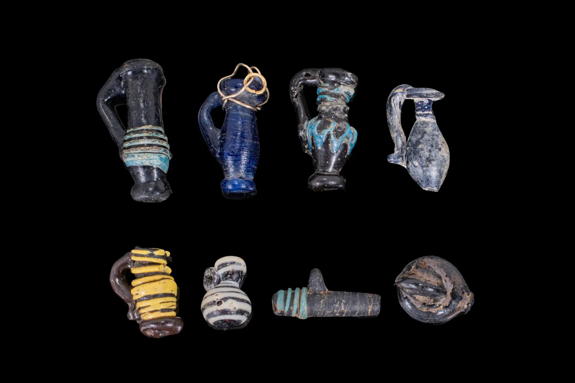 COLLECTION OF LATE ROMAN GLASS PENDANTS