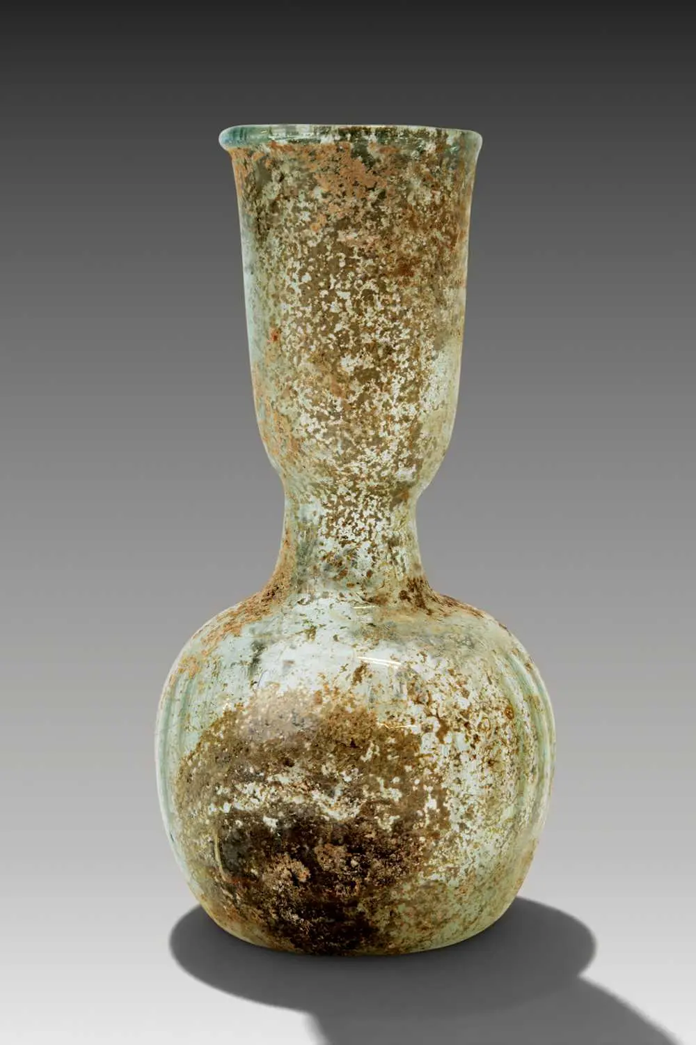 ROMAN GLASS UNGUENTARIUM WITH RIBBED MOTIF