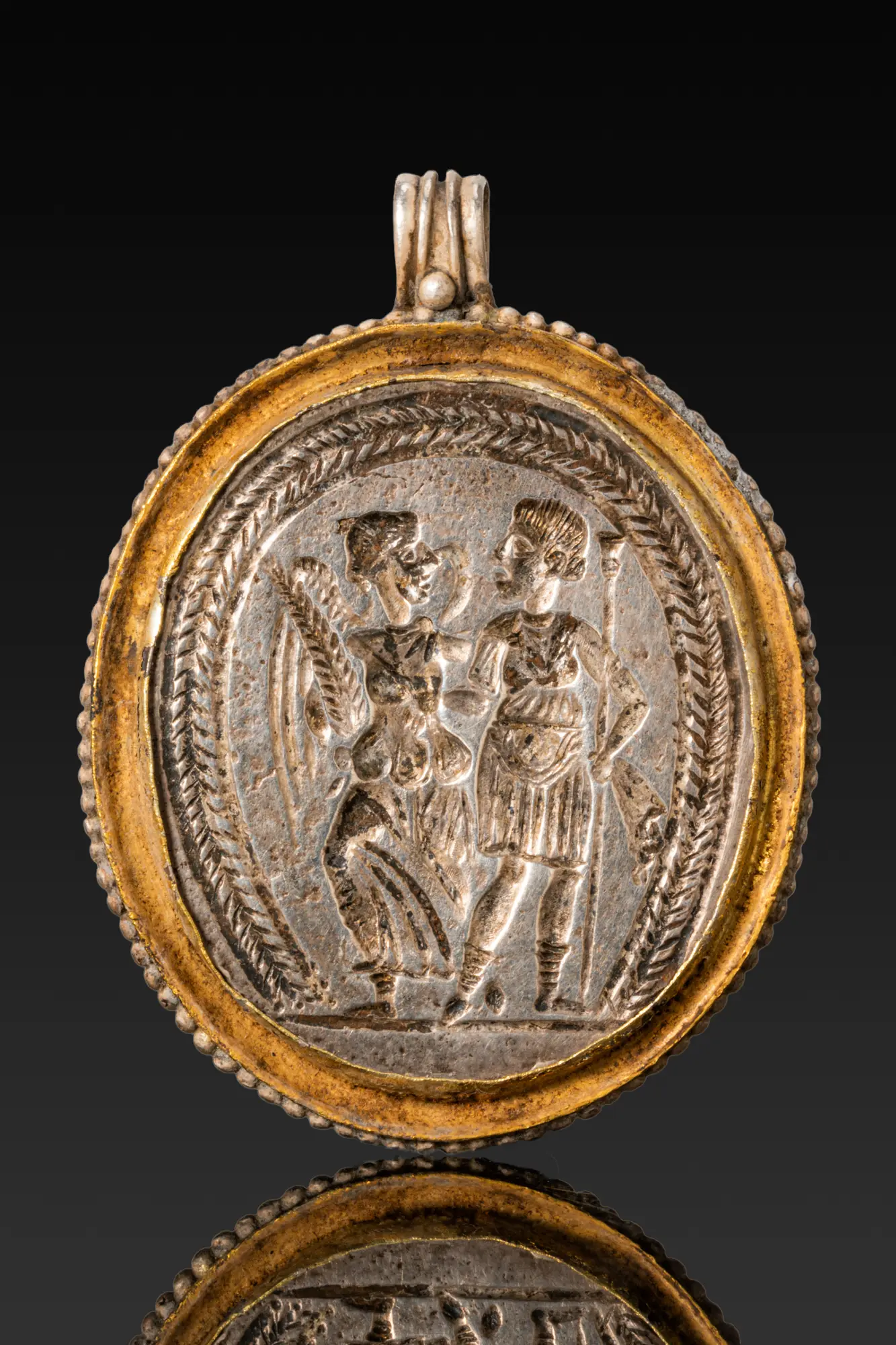 ROMAN SILVER-GILT MEDALLION WITH CERES AND ISIS
