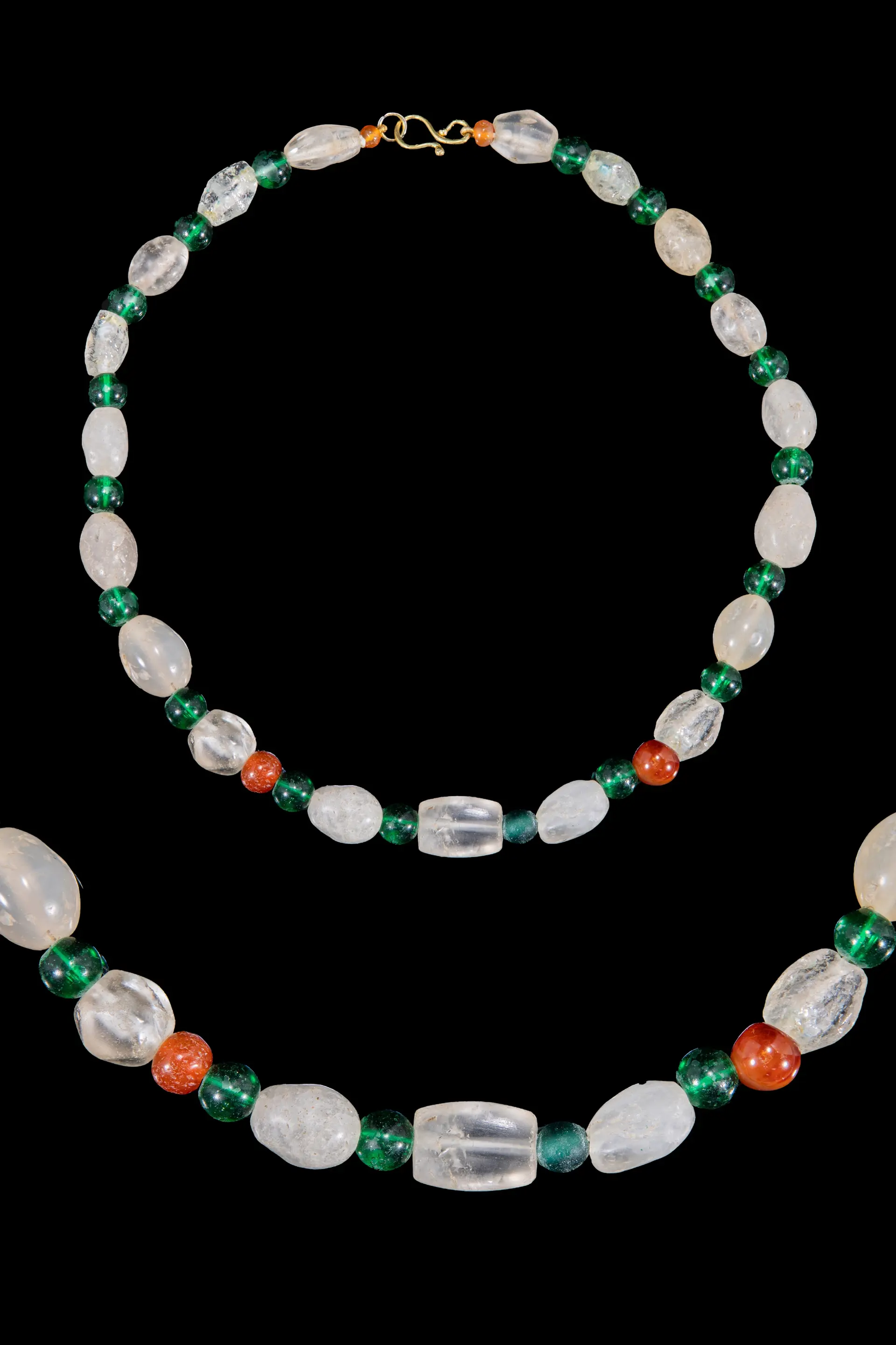 HELLENISTIC ROCK CRYSTAL, GREEN GLASS AND CARNELIAN BEAD NECKLACE