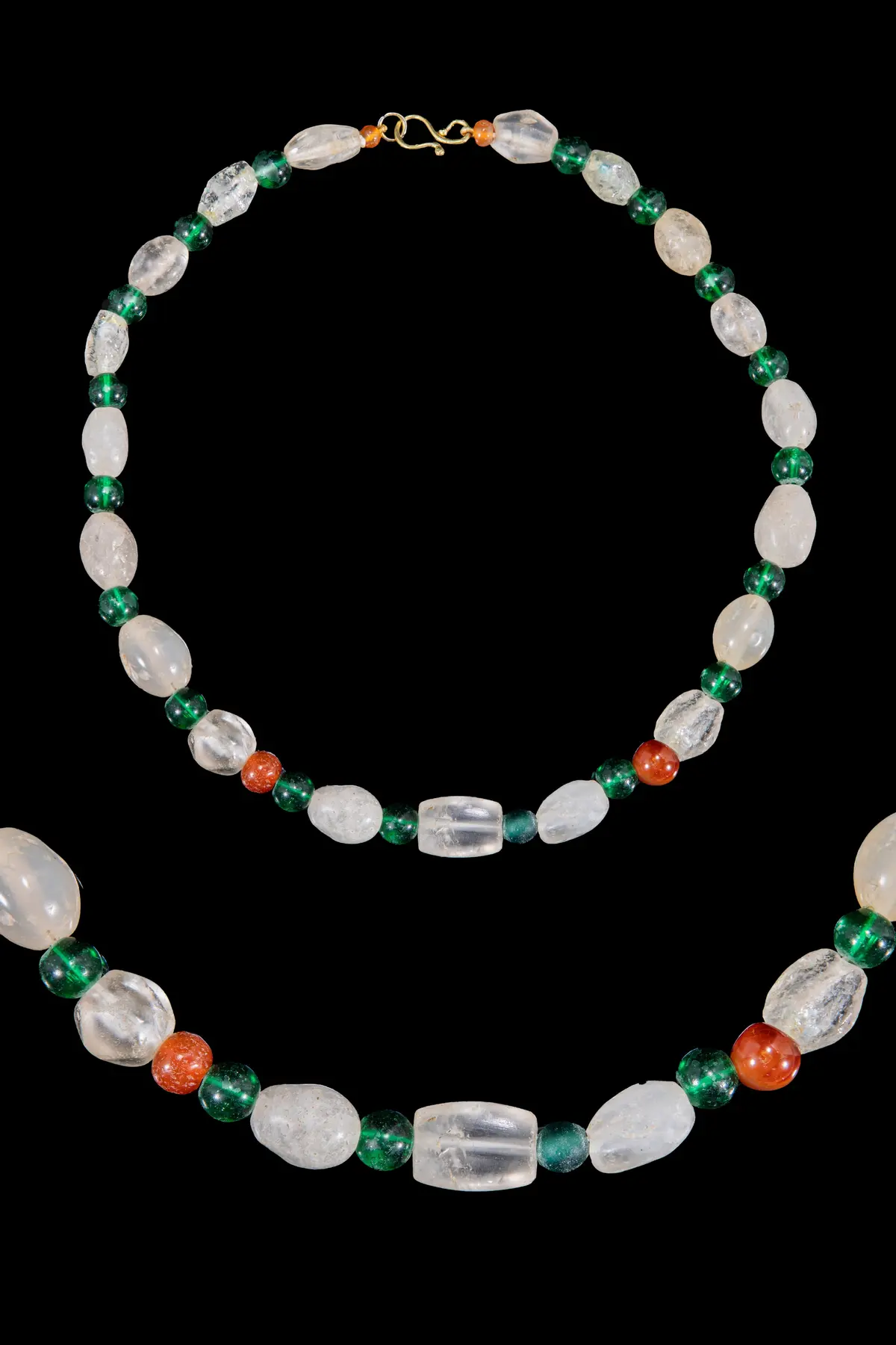 HELLENISTIC ROCK CRYSTAL, GREEN GLASS AND CARNELIAN BEAD NECKLACE