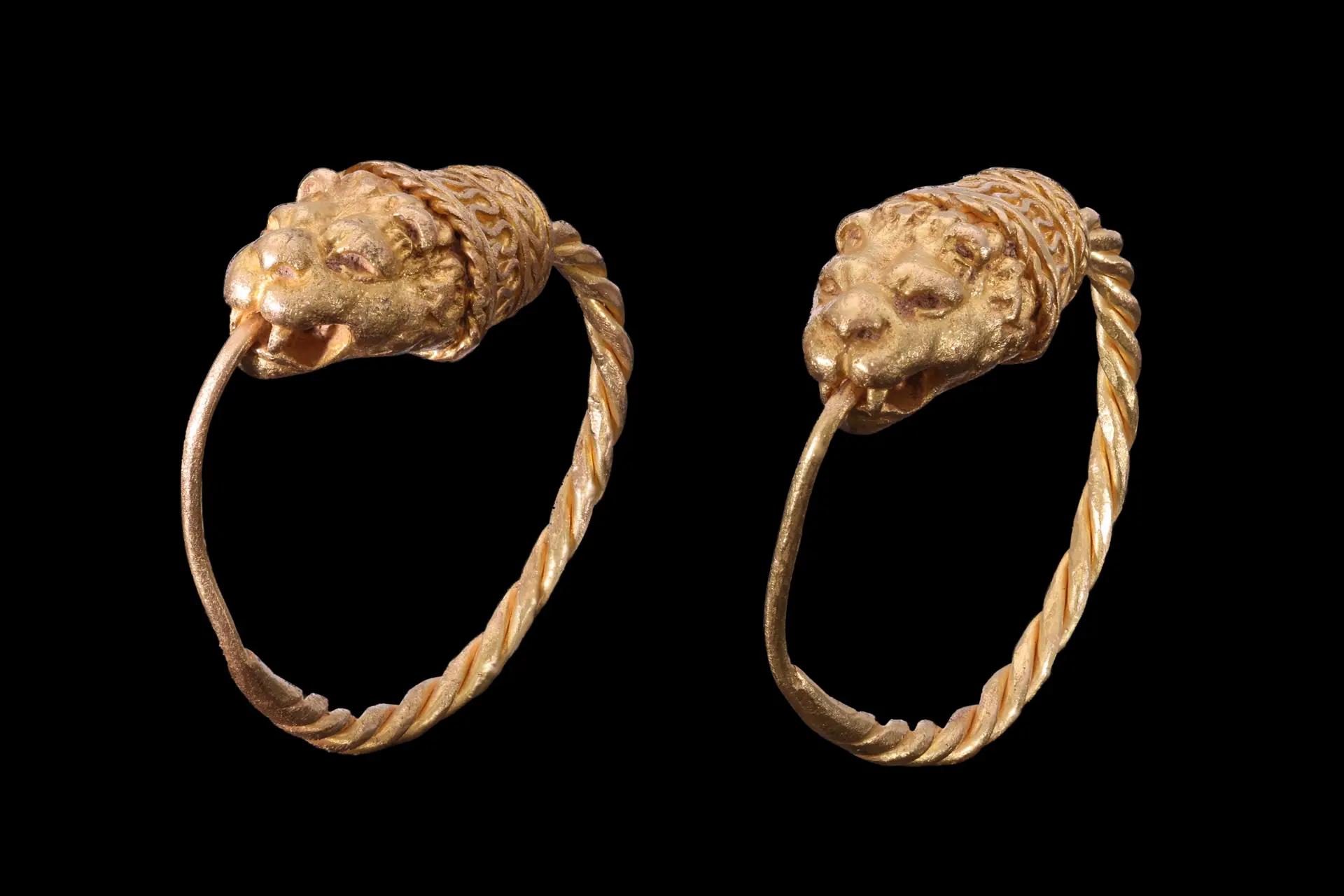 MATCHED PAIR OF HELLENISTIC GOLD EARRINGS WITH EROS HEADS