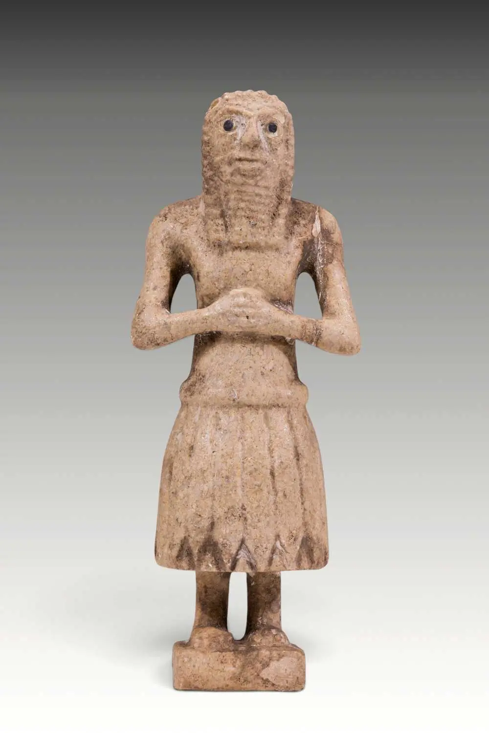 SUMERIAN MARBLE FIGURINE OF PRIEST WITH INLAID EYES