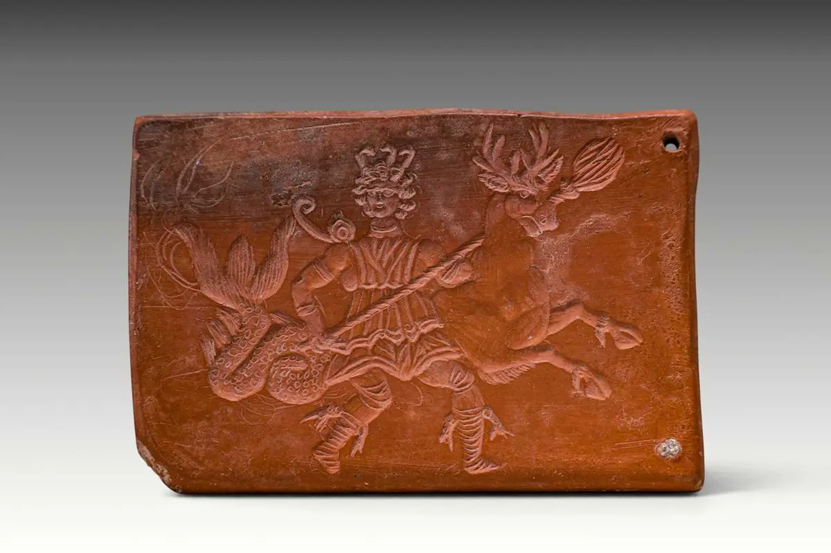 ROMAN TERRA SIGILLATA TILE DEPICTING A MARINE DEITY ON A SEA-RAM AND