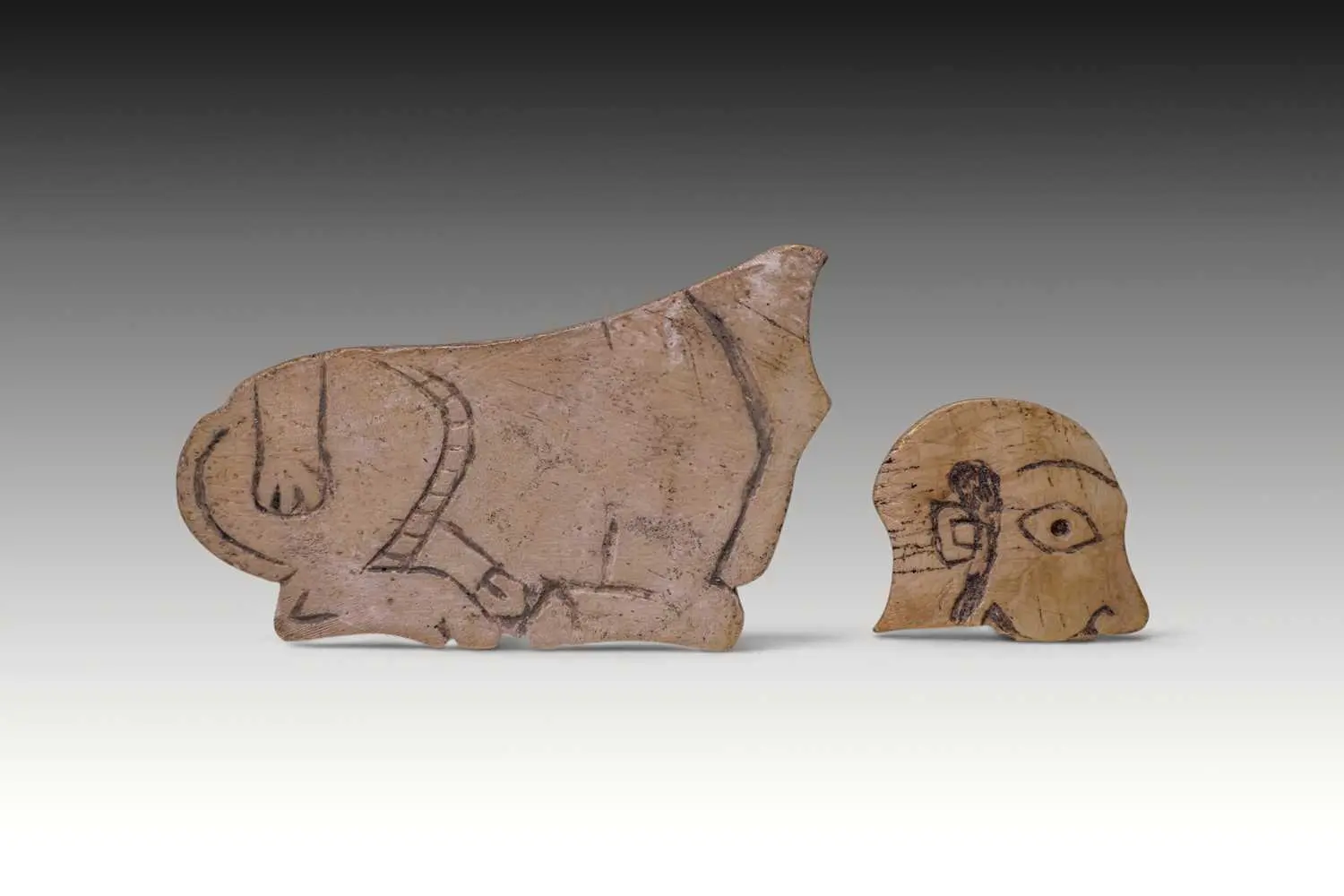 MESOPOTAMIAN SHELL INLAYS OF A BULL AND A MAN