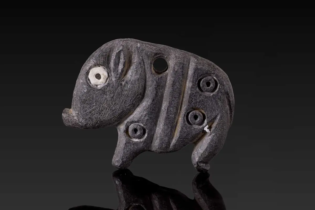 JEMDET NASR STONE AMULET IN THE FORM OF A HOG